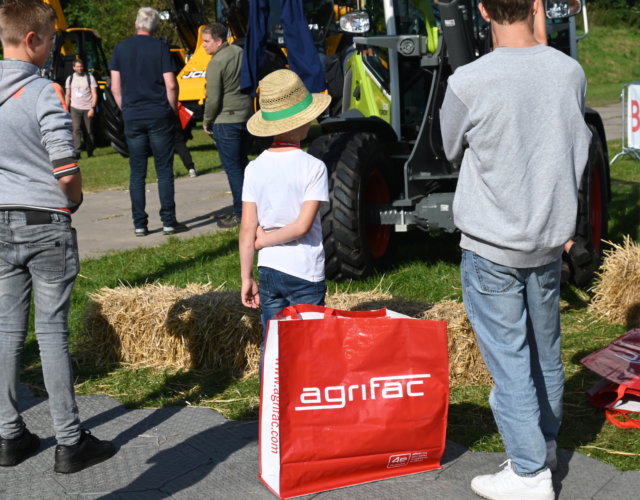 Boy looking into the distance with an Agrifac bag in the foreground.