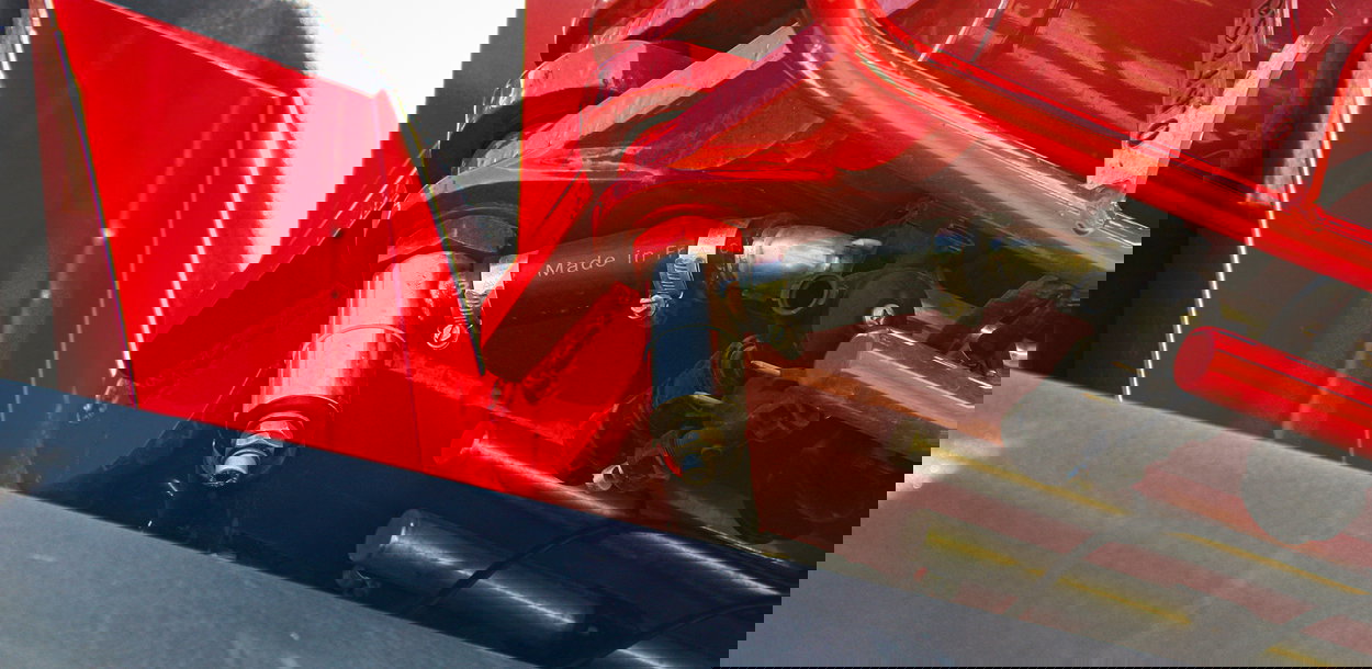 Close up view of a J boom component.