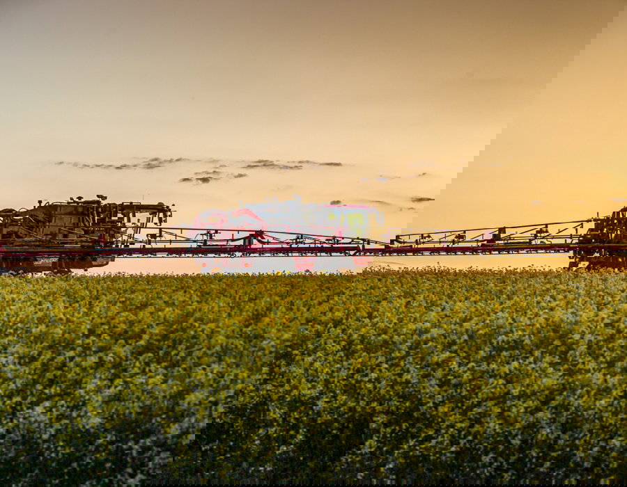 Condor Clearance operating in a field with lights on.