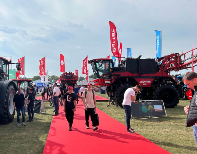 Sprayers lined up at an outdoor exhibition.