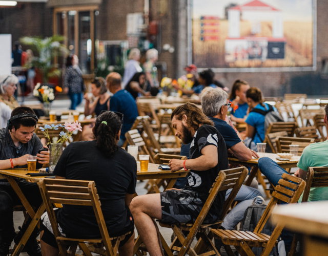 People seated inside a building.