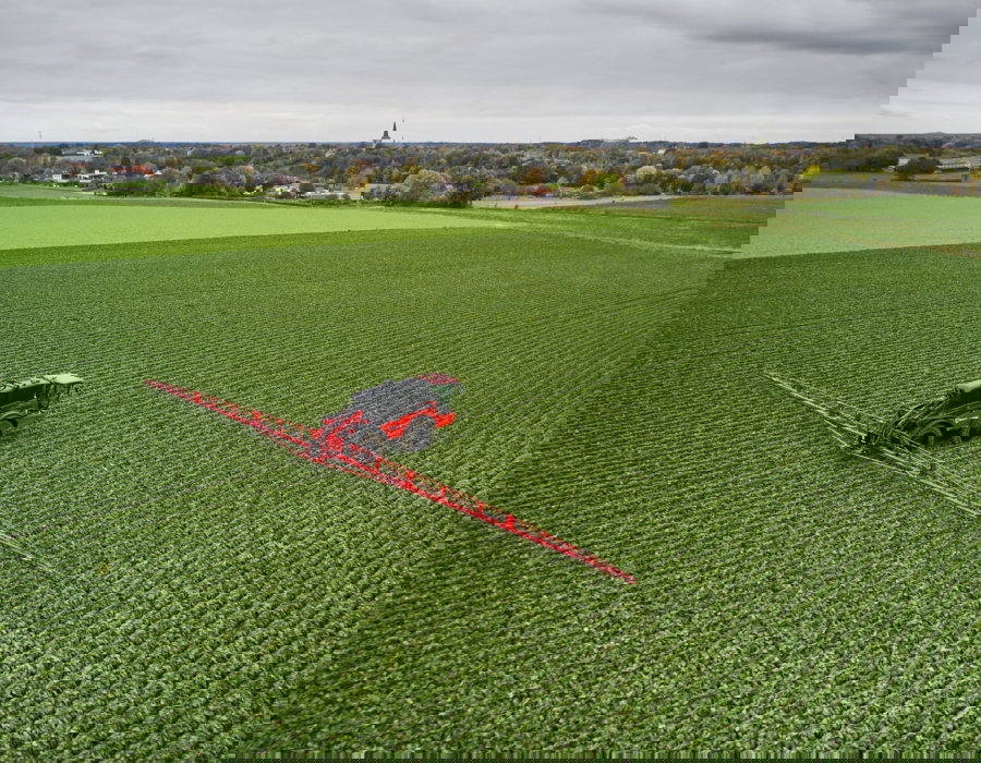 Vanguard 67 operating in a vast green field.