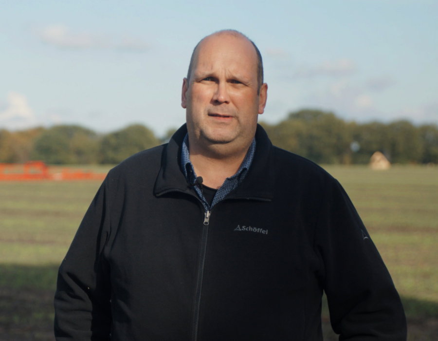 Markus Tietjen standing in an agricultural field.