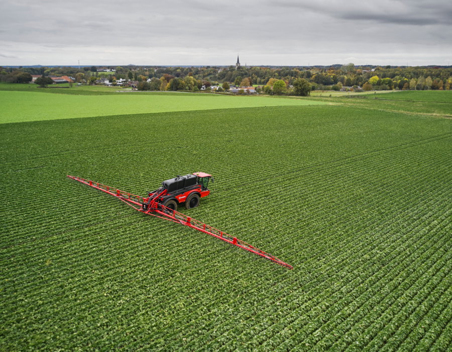 Vanguard 67 operating in a vast green field.