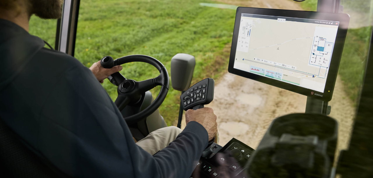 Inside view of the Agrifac cab showing the EcoTronicPlus operating screen.