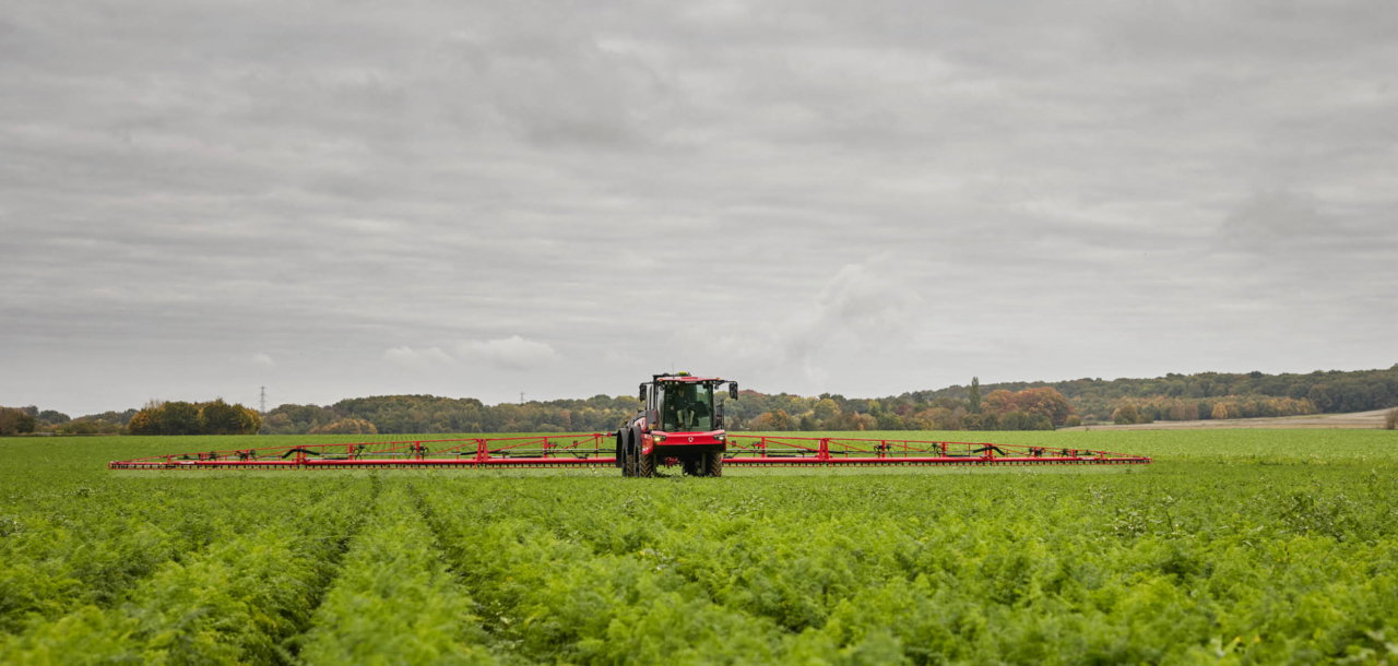 Agrifac Vanguard 67 sprayer spraying in a green field.