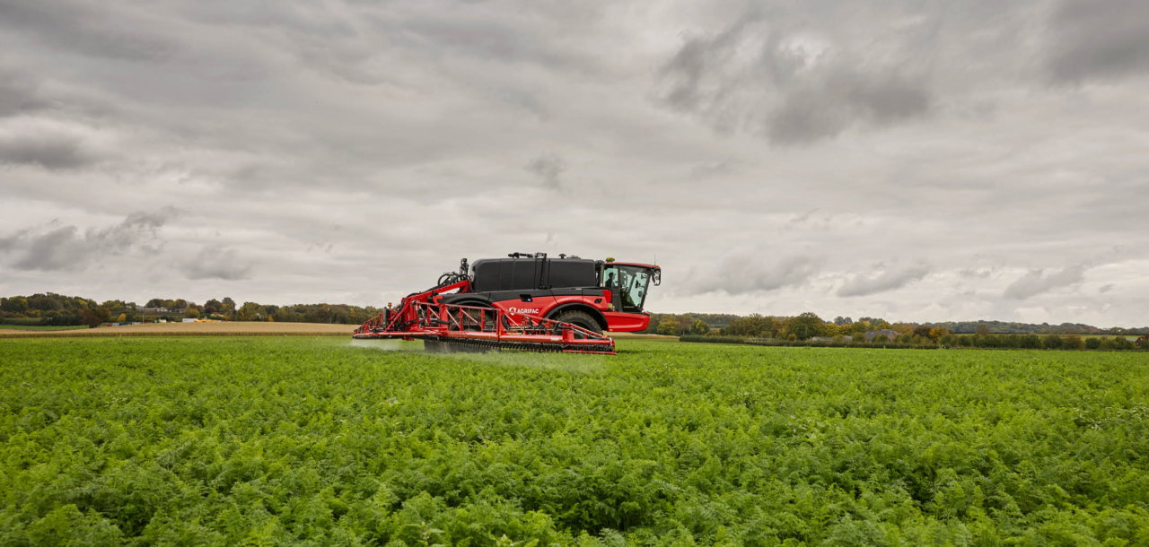 Agrifac Vanguard 67 sprayer spraying in a green field.