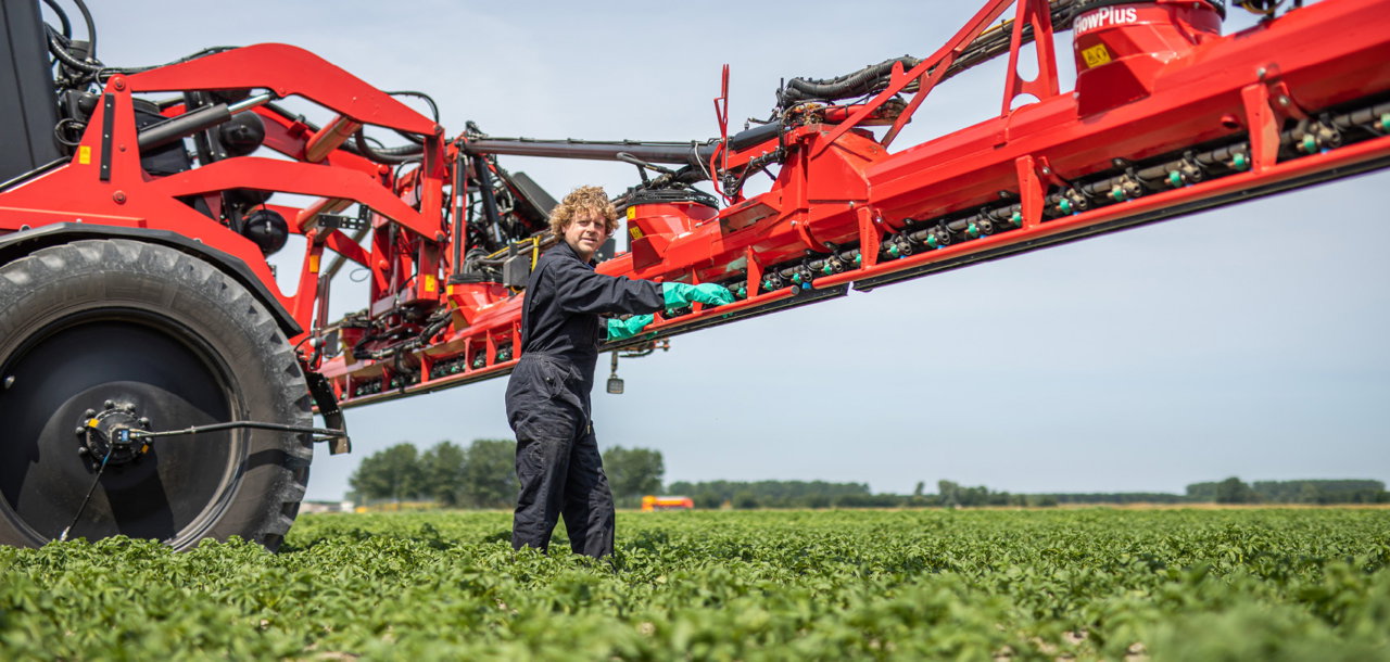 Man operating the AirFlowPlus boom in the field.