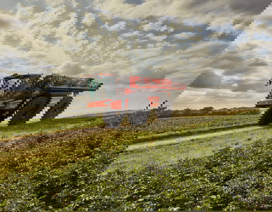 Endurance 80 standing still on the road with booms folded.