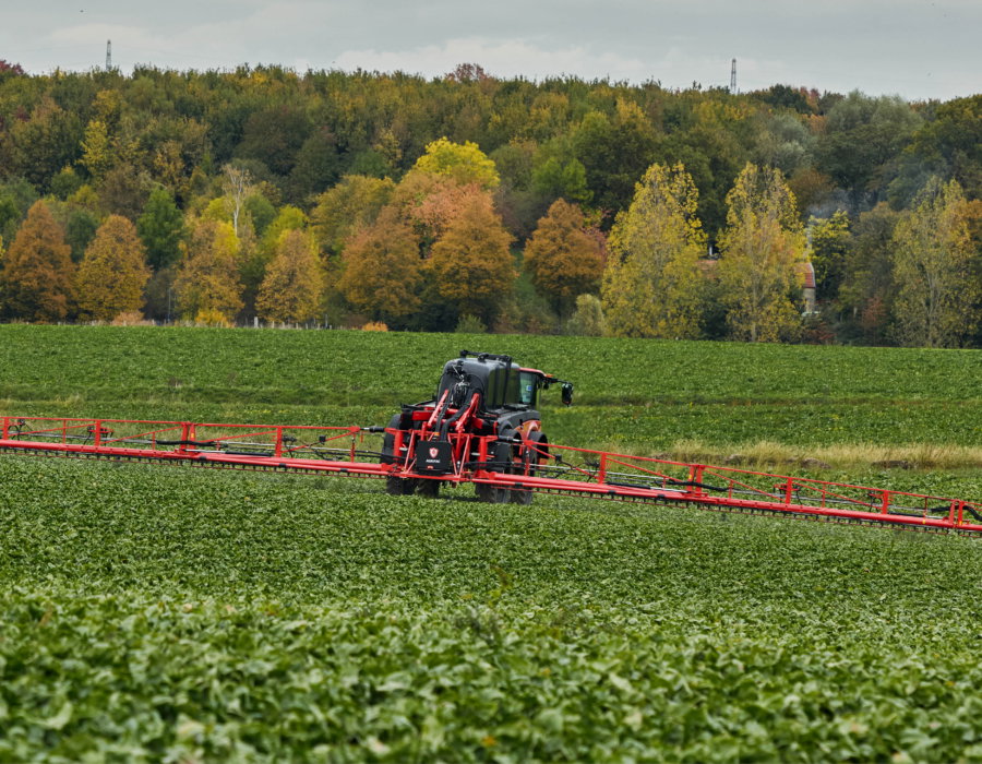 Rear view of the Vanguard 55 spraying in a hilly landscape.