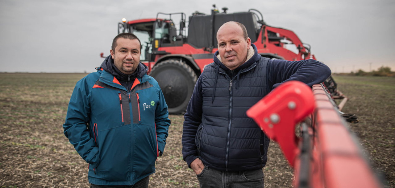 Alexander Degianski and colleague from Forest and Biomass Romania standing next to the AICPlus sprayer.