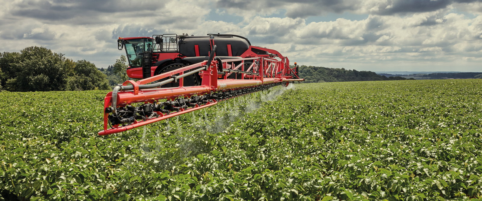 Agrifac sprayer spraying in a green field.