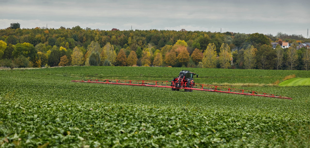 Agrifac Vanguard 55 sprayer spraying in a green field.