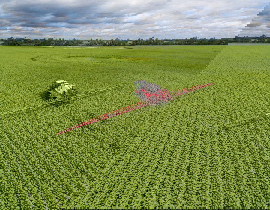 Agrifac Condor sprayer driving in a flat field.