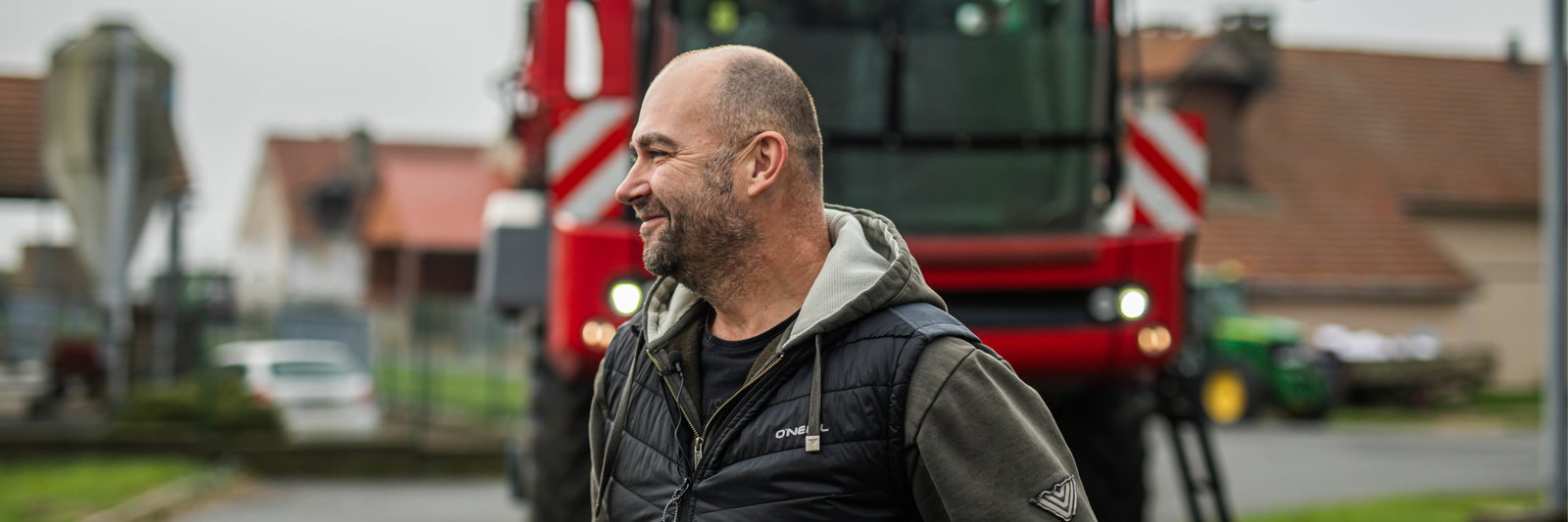 Man standing in front of an Agrifac sprayer.