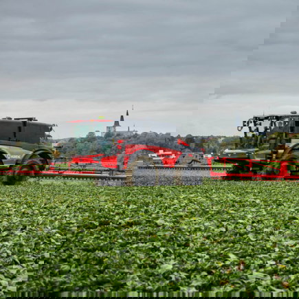 Agrifac Vanguard 67 sprayer driving through a green landscape.