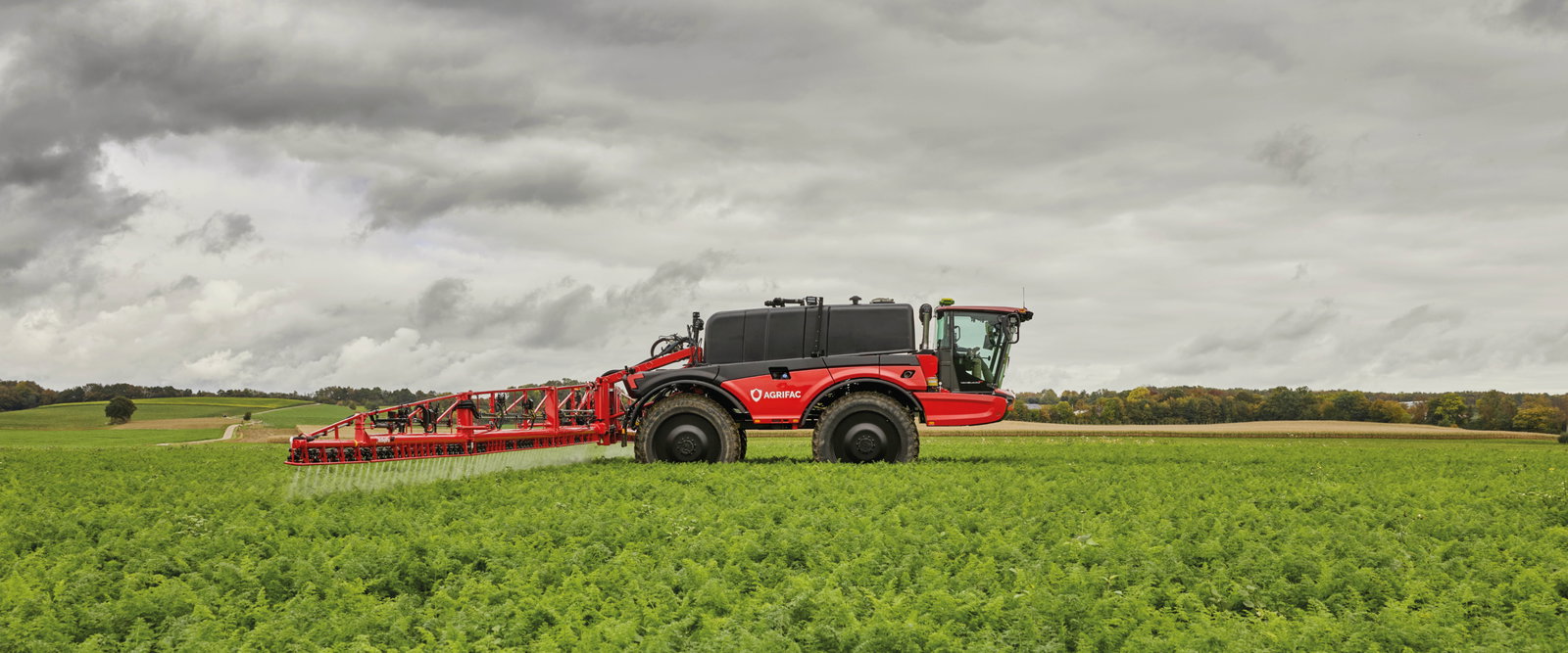 Agrifac Vanguard 67 sprayer spraying in a green field.